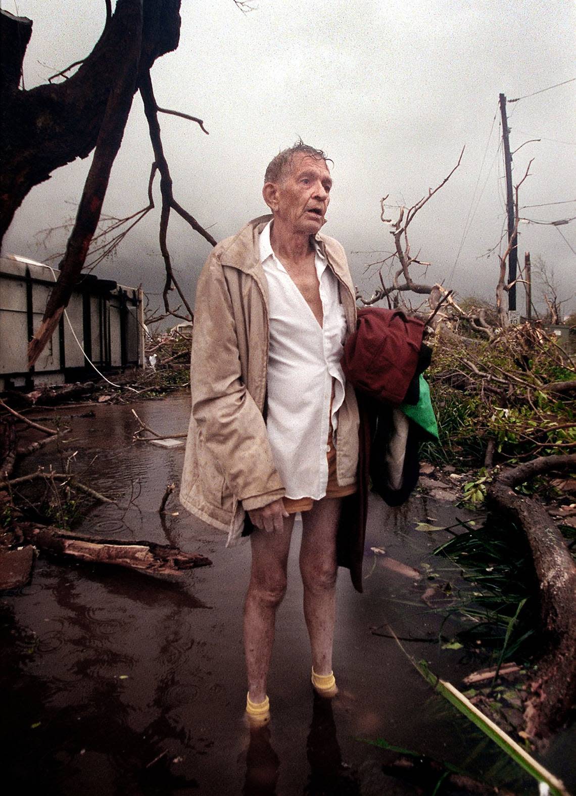 Harold “Tex” Keith stands outside his trailer park home at ground zero on Aug. 24, 1992, in Florida City after after Hurricane Andrew left the area.