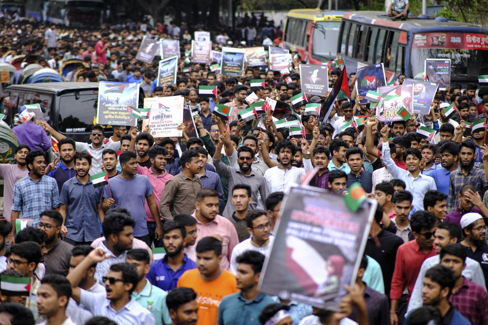 Bangladeshi students wave Palestinian flags, as they march during a pro- Palestinian demonstration at the Dhaka University area in Dhaka, Bangladesh, Monday, May 6, 2024. (AP Photo/ Mahmud Hossain Opu )