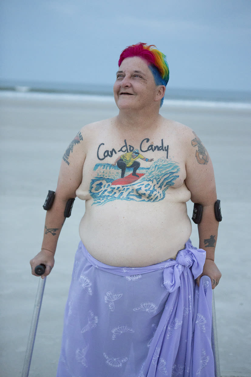 A breast cancer survivor poses on the beach. (Photo: Charise Isis/The Grace Project)