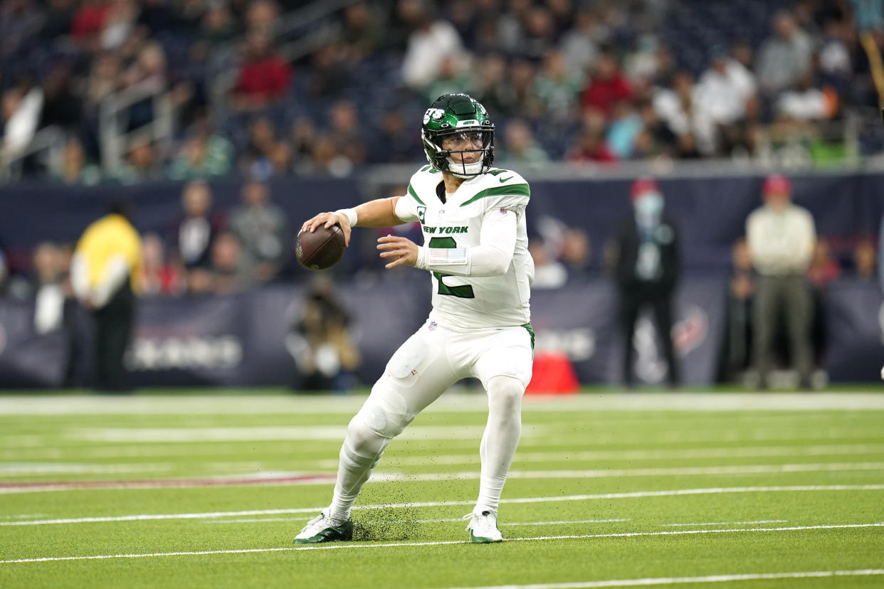 New York Jets quarterback Zach Wilson (2) looks to pass during an NFL football game against the Houston Texans, Sunday, Nov. 28, 2021, in Houston. (AP Photo/Matt Patterson)