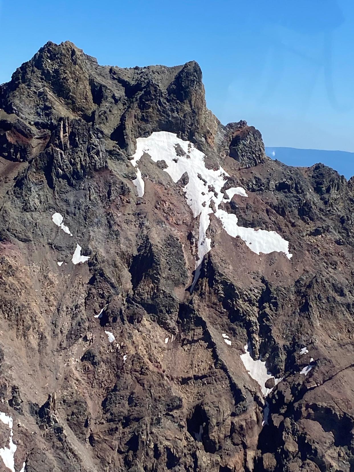 Search and rescue personnel and volunteers were searching for a hiker who fell several hundred feet on Monday near the summit of North Sister in steep and rocky terrain.