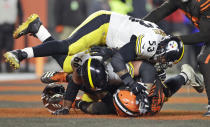 Cleveland Browns defensive end Myles Garrett, bottom, and, Pittsburgh Steelers center Maurkice Pouncey (53) and offensive guard David DeCastro (66) fall to the turf during a brawl in the second half of an NFL football game Thursday, Nov. 14, 2019, in Cleveland. The Browns won 21-7. (AP Photo/Ron Schwane)