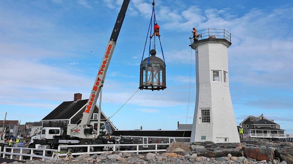 The top of  the Scituate Lighthouse is removed to make way for a replacement Thursday, Oct. 6, 2022.