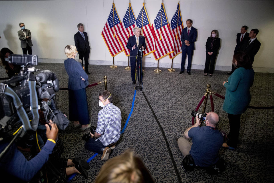 Senate Majority Leader Mitch McConnell, R-Ky., center, accompanied by from left, Sen. Roy Blunt, R-Mo., Sen. John Thune, R-S.D., Sen. Joni Ernst, R-Iowa, Sen. John Barrasso, R-Wyo., and Sen. Todd Young, R-Ind., speaks during a news conference following a Senate policy luncheon on Capitol Hill, Tuesday, June 16, 2020, in Washington. (AP Photo/Andrew Harnik)