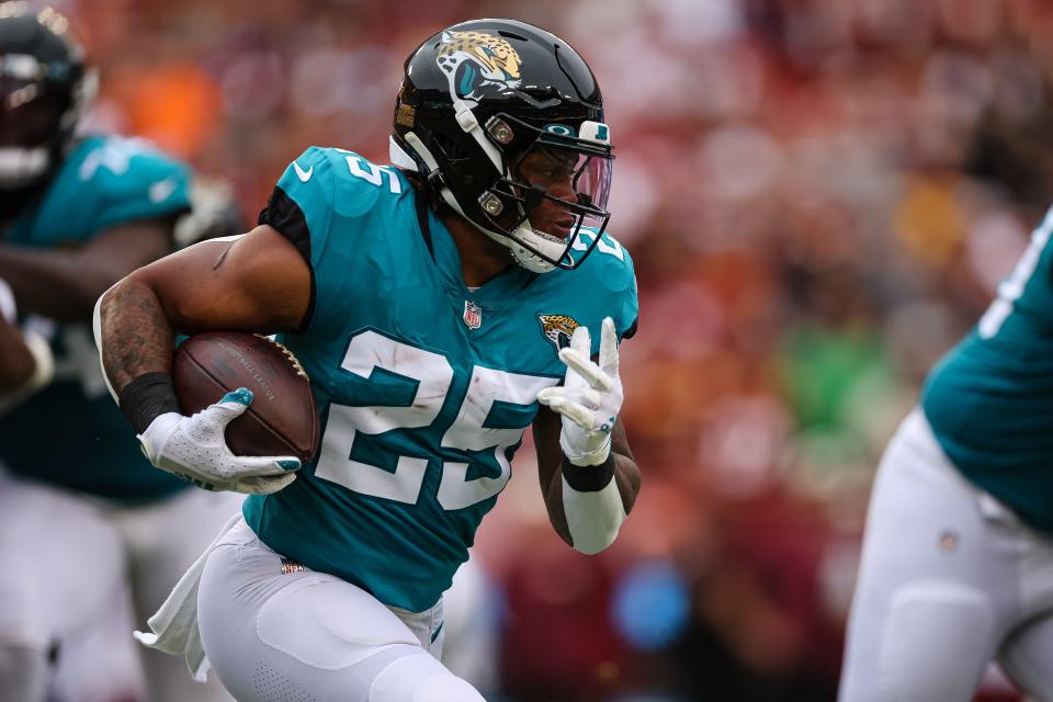 Sep 11, 2022; Landover, Maryland, USA; Jacksonville Jaguars running back James Robinson (25) carries the ball against the Washington Commanders during the first half at FedExField. Mandatory Credit: Scott Taetsch-USA TODAY Sports