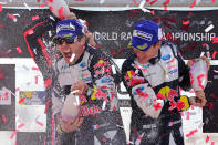 <p>French driver Sebastien Ogier, left, and co-driver Julien Ingrassia celebrate on the podium after winning the Portugal WRC rally in Matosinhos, northern Portugal, May 21, 2017. (Photo: Miguel Riopa/AFP/Getty Images) </p>