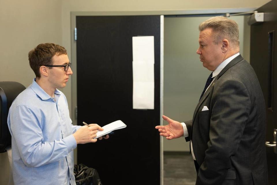 Wichita Eagle reporter Michael Stavola, left, interviews Wichita Chief of Police Joe Sullivan. Stavola recently won the News Leaders Association award for accountability journalism for a series of stories he wrote about the Wichita Police Department’s text messaging scandal, which started before Sullivan was at the department but continues to have ramifications. File photo