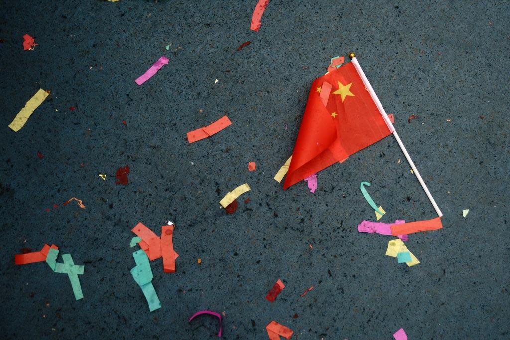 A Chinese flag lays on the ground in New York, 16 February 16, 2018: Getty Images