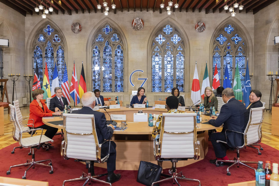 Clockwise from left, the Foreign Minister of France, Catherine Colonna, Secretary of State of the United States, Antony Blinken, the Foreign Minister of the Republic of Ghana, Alfred Mutua, German Foreign Minister Annalena Baerbock, the Foreign Minister of the Republic of Ghana, Shirley Ayorkor Botchwey, Canadian Foreign Minister Melanie Joly, Japan's Foreign Minister Yoshimasa Hayashi, the Foreign Minister of Great Britain, James Cleverly, the Vice Chair of the African Union Commission, Monique Nsanzabaganwa and the EU Representative for Foreign Affairs, Josep Borrell, talk at the Historic Town Hall during the G7 Foreign Ministers Meeting in Muenster, Germany, Friday, Nov. 4, 2022. (Rolf Vennenbernd/DPA via AP, Pool)