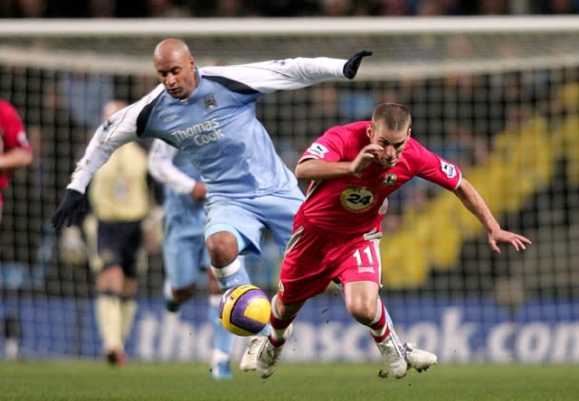 Ousmane Dabo (left) was left with injuries by Joey Barton 