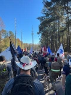 Iron Ruck participants marching into Auburn.