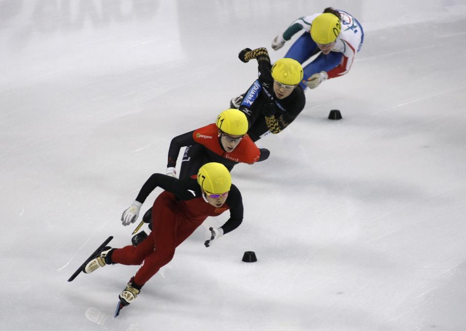 SHANGHAI, CHINA - DECEMBER 09: (L-R) Meng Wang of China, Marianne St-gelais of Canada, Ayuko Ito of Japan, Martina Valcepina of Italy compete in the Women's 3000m Relay Final during the day two of the ISU World Cup Short Track at the Oriental Sports Center on December 9, 2012 in Shanghai, China. (Photo by Hong Wu/Getty Images)