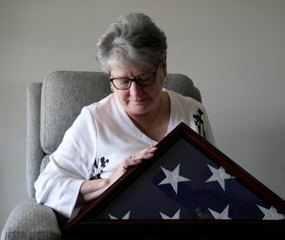 In her West Jefferson home, Michelle Ray has many items to remind her of her late husband, Tom, who served in the U.S. Army in Vietnam, including the folded American flag presented to her by Army servicemembers at his January interment.