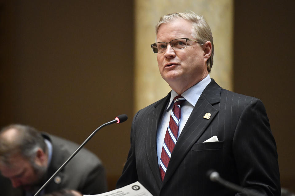 Kentucky State Senator Damon Thayer reads a document into the record during their session at the Kentucky State Capitol in Frankfort, Ky., Thursday, March 16, 2023. (AP Photo/Timothy D. Easley)