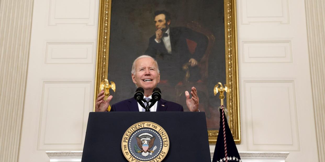 Joe Biden speaks at a podium.