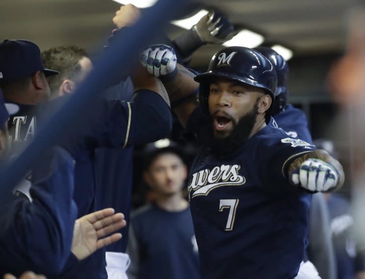 Milwaukee Brewers' Eric Thames celebrates his two-run home run with teammates during the first inning of a baseball game against the Boston Red Sox Tuesday, May 9, 2017, in Milwaukee. (AP Photo/Morry Gash)