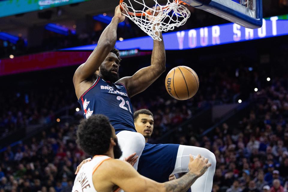 Joel Embiid dunks the ball against the San Antonio Spurs.