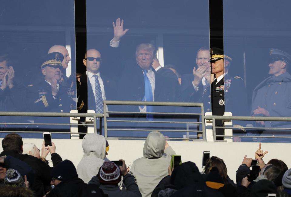 Donald Trump, then the president-elect at the time, acknowledges fans at the Army-Navy game in 2016. (AP) 