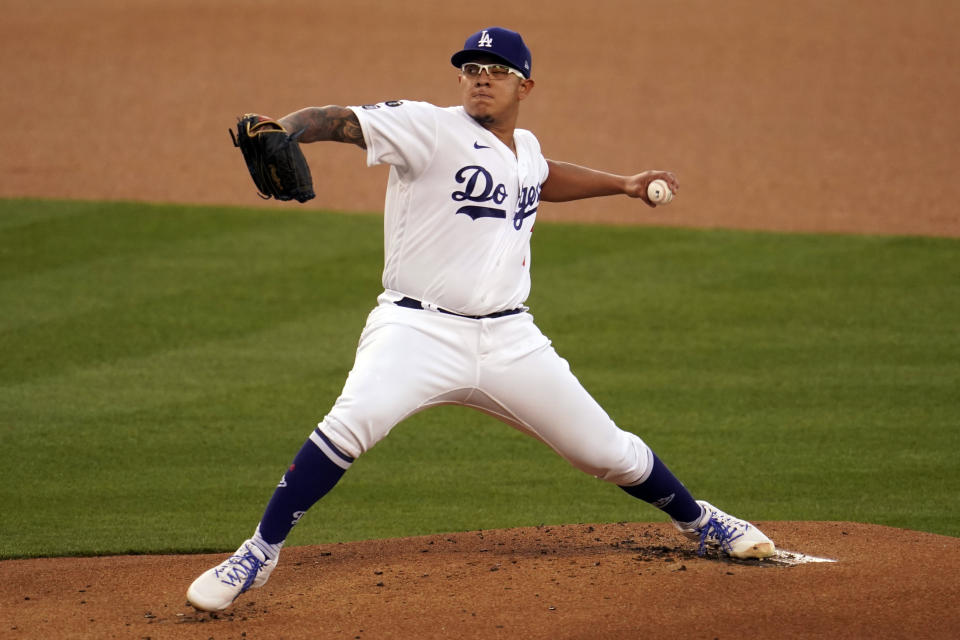 Los Angeles Dodgers starting pitcher Julio Urias throws to a Seattle Mariners batter during the first inning of a baseball game Wednesday, May 12, 2021, in Los Angeles. (AP Photo/Marcio Jose Sanchez)