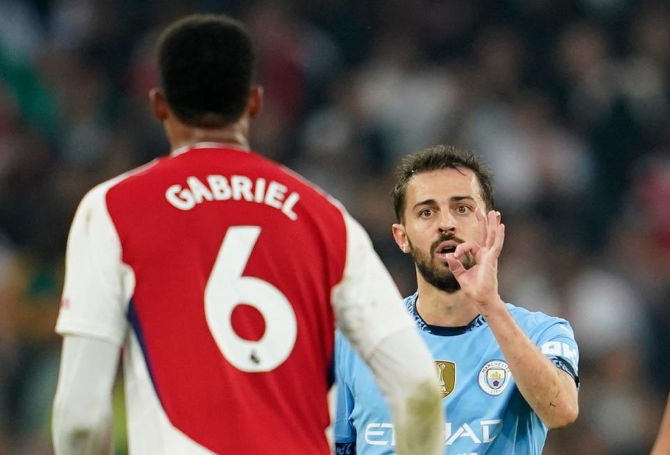 Manchester City's Bernardo Silva gestures at Arsenal's Gabriel (AP)