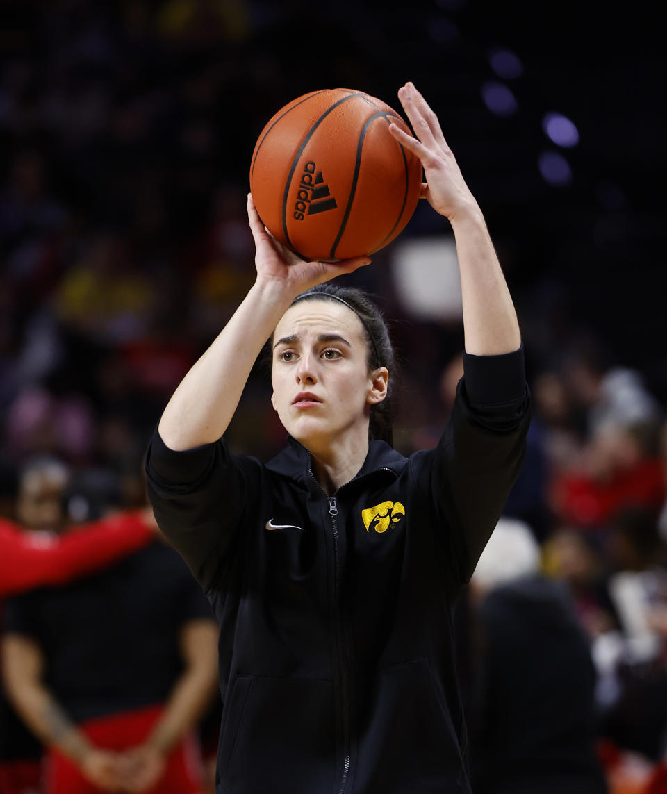 Iowa guard Caitlin Clark wams up for the team's NCAA college basketball game against Rutgers, Friday, Jan. 5, 2024, in Piscataway, N.J. (AP Photo/Noah K. Murray)