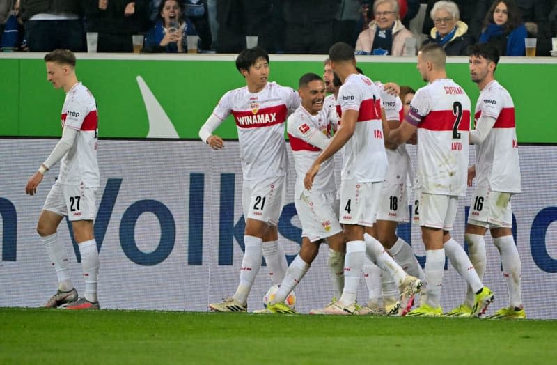 Stuttgart players celebrate their side's third goal during the German Bundesliga soccer match between TSG 1899 Hoffenheim and VfB Stuttgart at PreZero Arena. Jan-Philipp Strobel/dpa