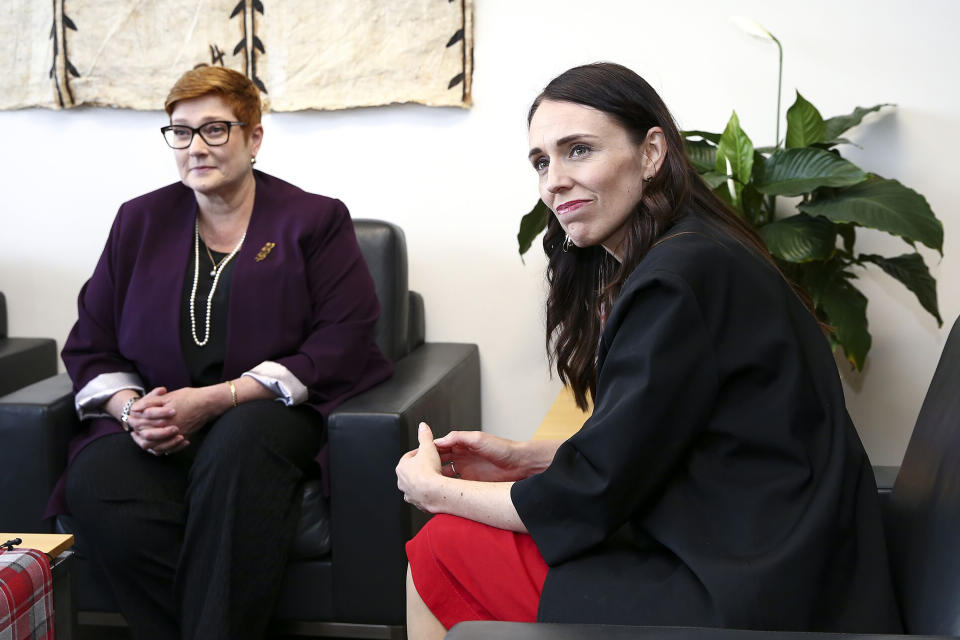 CORRECTS SPELLING TO MARISE INSTEAD OF MARISA - New Zealand Prime Minister Jacinda Ardern, right, sits with Australian Foreign Minister Marise Payne durng a meeting in Wellington, New Zealand, Monday, Dec 16, 2019. Payne is in Wellington to thank some of the first responders who helped at the White Island volcano eruption on Dec. 9. (Hagen Hopkins/Pool Photo via AP)