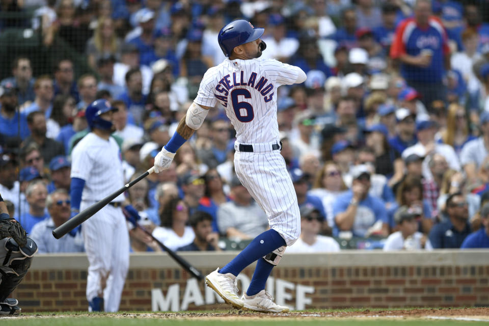 Chicago Cubs' Nicholas Castellanos watches his two-run home run during the second inning of a baseball game against the Milwaukee Brewers Friday, Aug 30, 2019, in Chicago. (AP Photo/Paul Beaty)