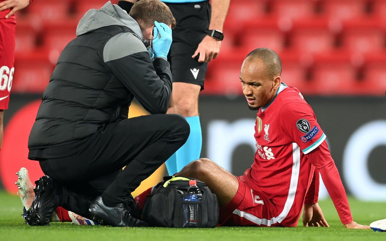 Liverpool's Fabinho picks up an injury during the UEFA Champions League Group D match at Anfield, Liverpool. - PA