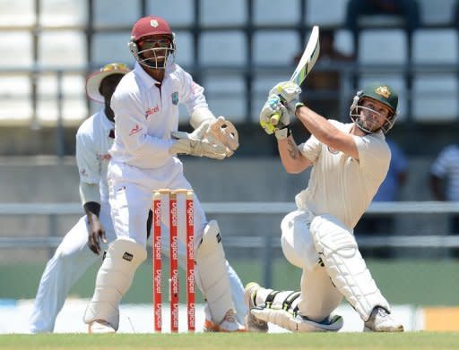 Australian batsman Matthew Wade slams a six in front of West Indies Carlton Baugh during the second day of the third test match between the West Indies and Australia in Roseau, Dominica, April 24. Wade said Brad Haddin remained Australia's number one Test match wicketkeeper despite his maiden test century Tuesday shifting the final West Indies Test in favour of the tourists