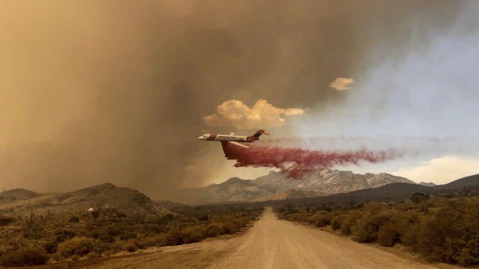 A tanker makes a fire retardant drop over the York Fire in Mojave National Preserve on Saturday. - R. Almendinger/InciWeb/National Park Service Mojave National Preserve/AP