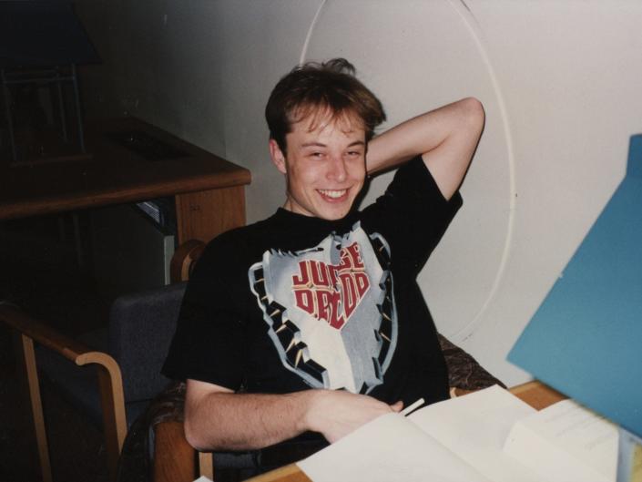 Elon Musk, a 23-year-old graduate of the University of Pennsylvania in 1994, shows himself happily wearing a Judge Dredd T-shirt in the fourth-floor study hall of one of the Quad towers.