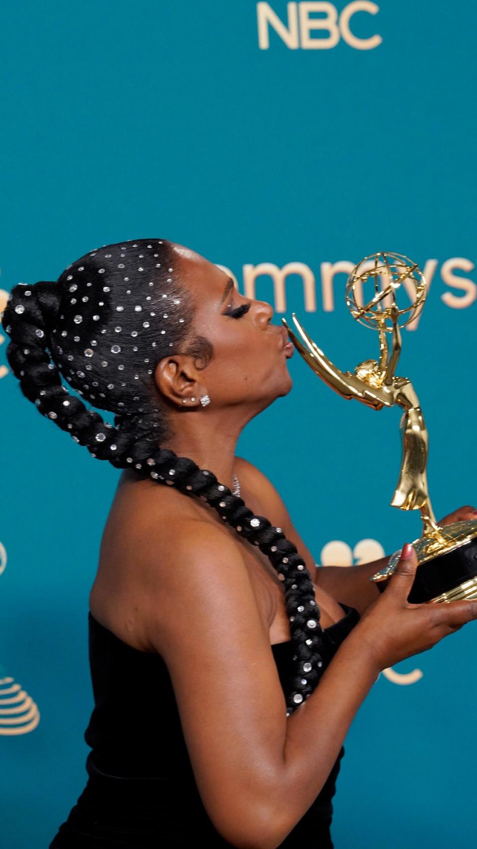 <p> She was one of the original Dreamgirls, and Sheryl Lee Ralph's bejewelled Emmys hair was the stuff of dreams. </p> <p> The legendary star of stage and screen took home the award for her work in Abbott Elementary, but it was her hair that really stole the show. </p> <p> Dazzling the red carpet, Sheryl Lee Ralph paired a custom gown with a bedazzled waist-length braided ponytail and matching face gems. </p>
