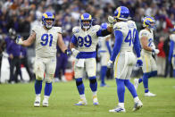 Los Angeles Rams defensive end Greg Gaines (91), defensive end Aaron Donald (99) and outside linebacker Von Miller (40) celebrate after a play against the Baltimore Ravens during the second half of an NFL football game, Sunday, Jan. 2, 2022, in Baltimore. The Rams won 20-19. (AP Photo/Gail Burton)