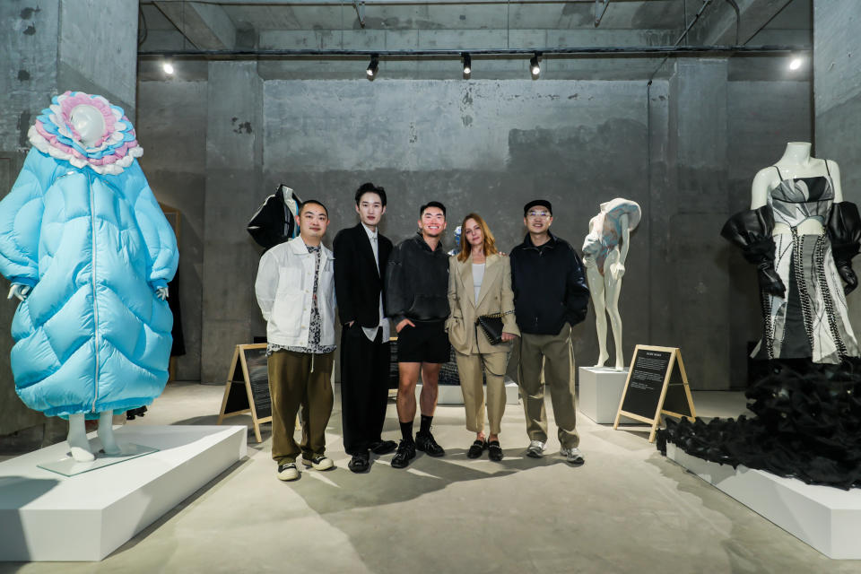 Stella McCartney with Chinese designers Jinwei Yin of Oude Waag, Chen Peng, Terrence Zhou of Bad Binch Tongtong, and Gong Li of 8on8 at the "Future of Fashion: An innovation conversation with Stella McCartney” exhibit installation.