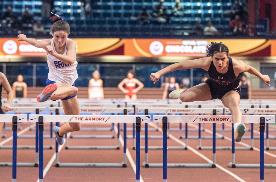 Keira Lee of Pearl River and Junibel Fernandez of Nyack compete in the 55 meter hurdles during the Section 1 Class B track and field championships at The Armory in Manhattan Feb. 4, 2024.