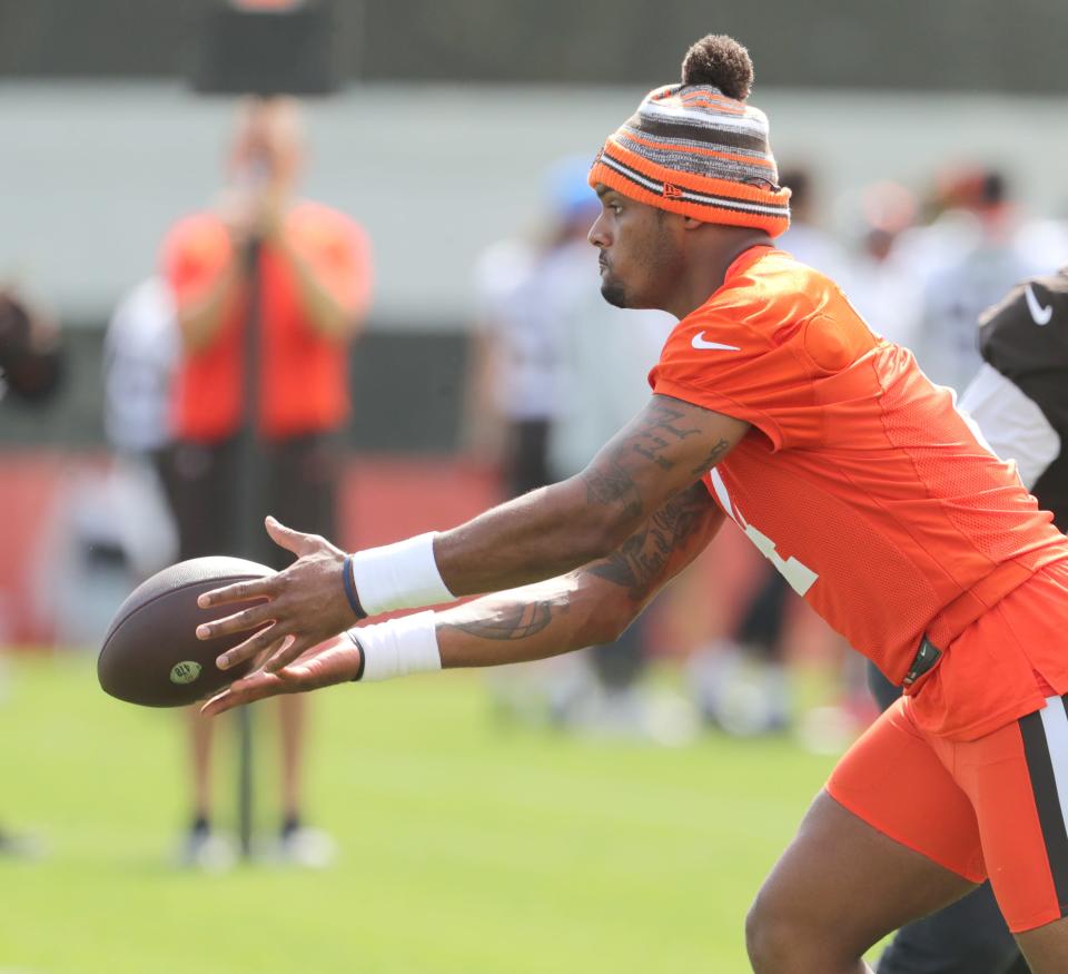 Cleveland Browns quarterback Deshaun Watson pitches out to a running back during OTA practice on Wednesday, May 25, 2022 in Berea.