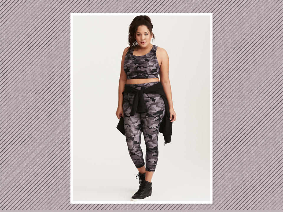 <p>Cool In Camo Active Leggings, $55 (on sale $33), and Sports Bra, $39 (on sale $24), <a rel="nofollow noopener" href="https://www.torrid.com/product/cool-in-camo-active-set/TD_ACTIVE+SM1+10839540_10839548.html#q=camo&start=14" target="_blank" data-ylk="slk:Torrid;elm:context_link;itc:0;sec:content-canvas" class="link ">Torrid</a> (Photo: Torrid) </p>