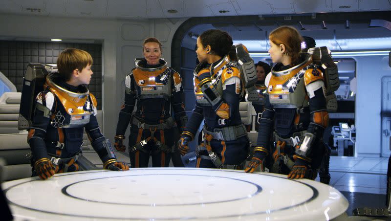 Max Jenkins stars as Will Robinson, left, Molly Parker as Maureen, Taylor Russell as Judy and Mina Sundwall as Penny in Netflix’s new adaptation of “Lost in Space.” Netflix 1