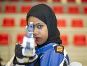 Kuwaiti Shooter Mariam Erzouqi, 24, poses as she takes aim during practice at the Kuwait Sheikh Sabah Al-Ahmad Olympic Shooting Complex in Kuwait, May 26, 2012. Mariam Erzouqi grips her German-made air rifle with carefully-manicured hands, steadies her footing, eyes the target and slowly pulls the trigger until a soft crack echoes through Kuwait's cavernous shooting range. The 24-year-old is set to become the second Kuwaiti woman to compete at an Olympic Games and will take dead aim at a medal in the 10 and 50 meters air rifle in London.