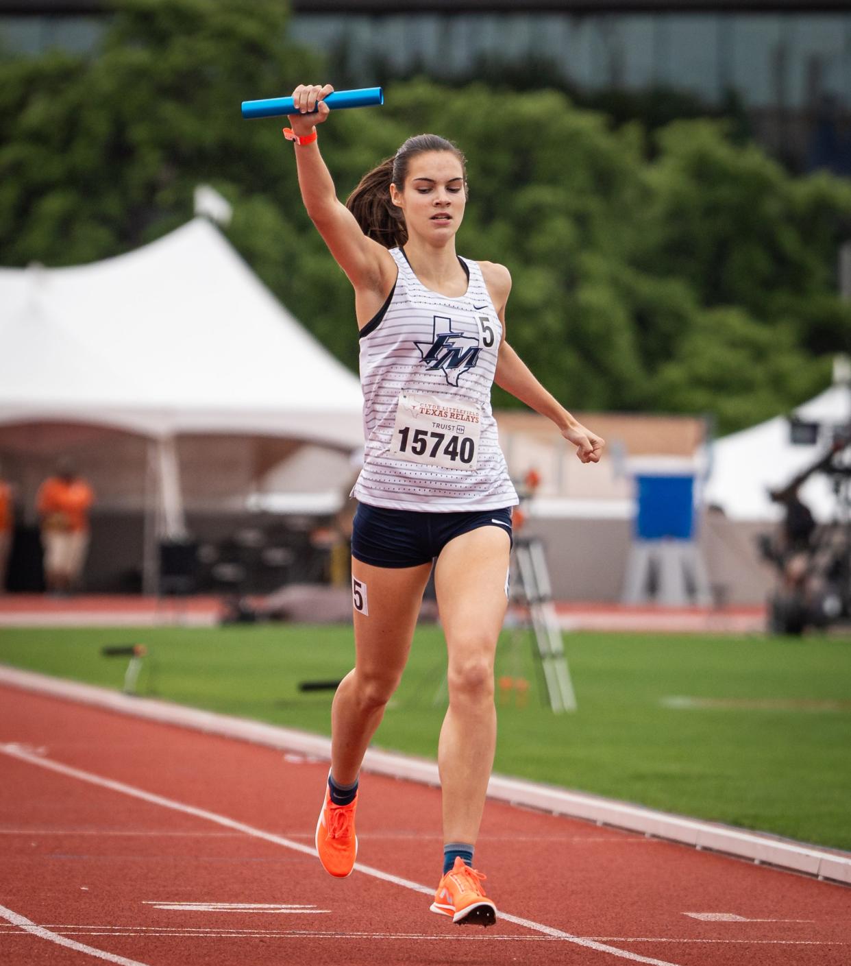 Samantha Humphries of Flower Mound crosses the line to win the 3,200-meter relay Saturday.