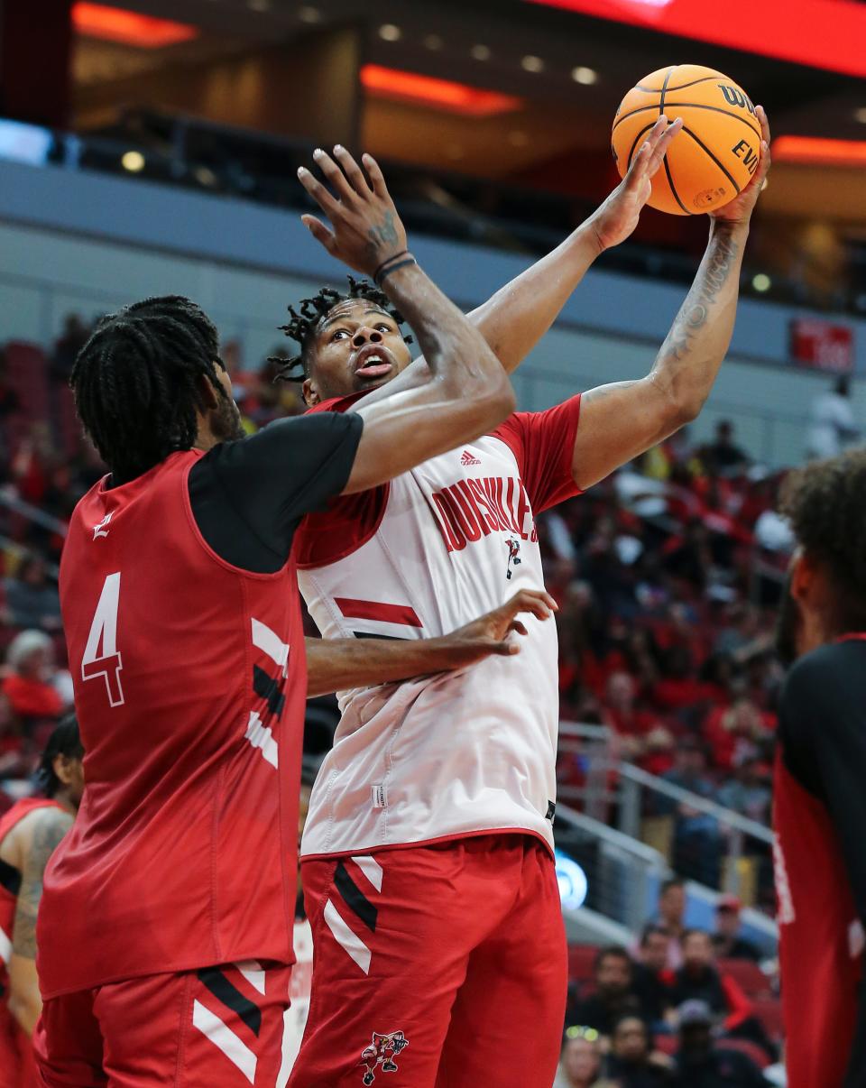 U of L's Sydney Curry (21) shot against Roosevelt Wheeler (4) during their red/white scrimmage at the Yum Center in Louisville, Ky. on Oct. 23, 2022.