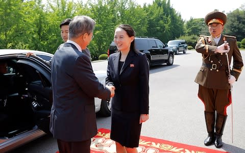 Moon Jae-in shakes hands with Kim Yo-jong - Credit: AFP/Getty Images