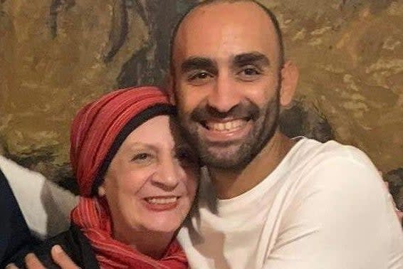 <p>Karim Ennarah with his mother after release</p> (Jessica Kelly)