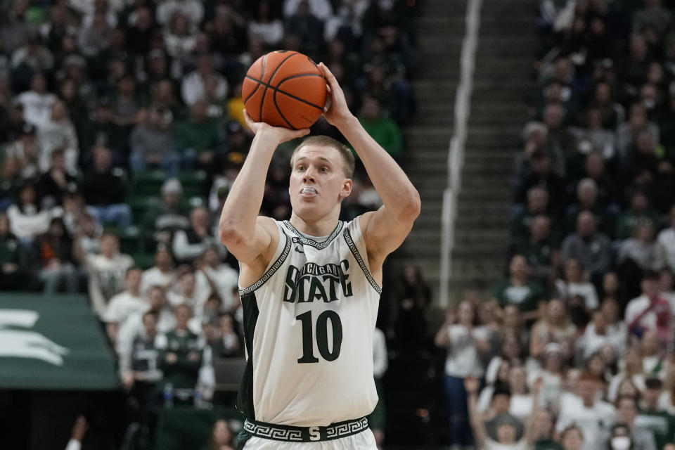 Michigan State forward Joey Hauser shoots a three-point basket during the second half of an NCAA college basketball game against Iowa, Thursday, Jan. 26, 2023, in East Lansing, Mich. (AP Photo/Carlos Osorio)