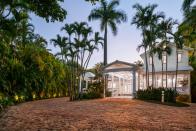 <p>A private three-bedroom, three-bathroom guesthouse sits at the front of the property, right by the estate's gated entrance.</p>