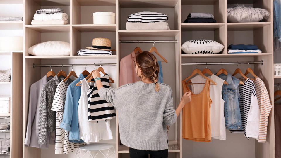 girl organizing large closet