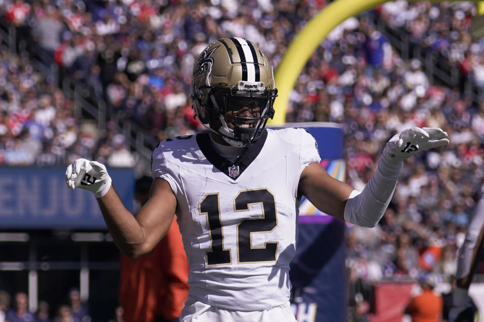 New Orleans Saints wide receiver Chris Olave (12) celebrates after his touchdown during the first half of an NFL football game against the New England Patriots, Sunday, Oct. 8, 2023, in Foxborough, Mass. (AP Photo/Charles Krupa)