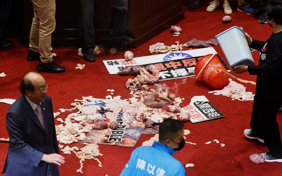 Pork intestines are seen during a scuffle in the parliament  - REUTERS