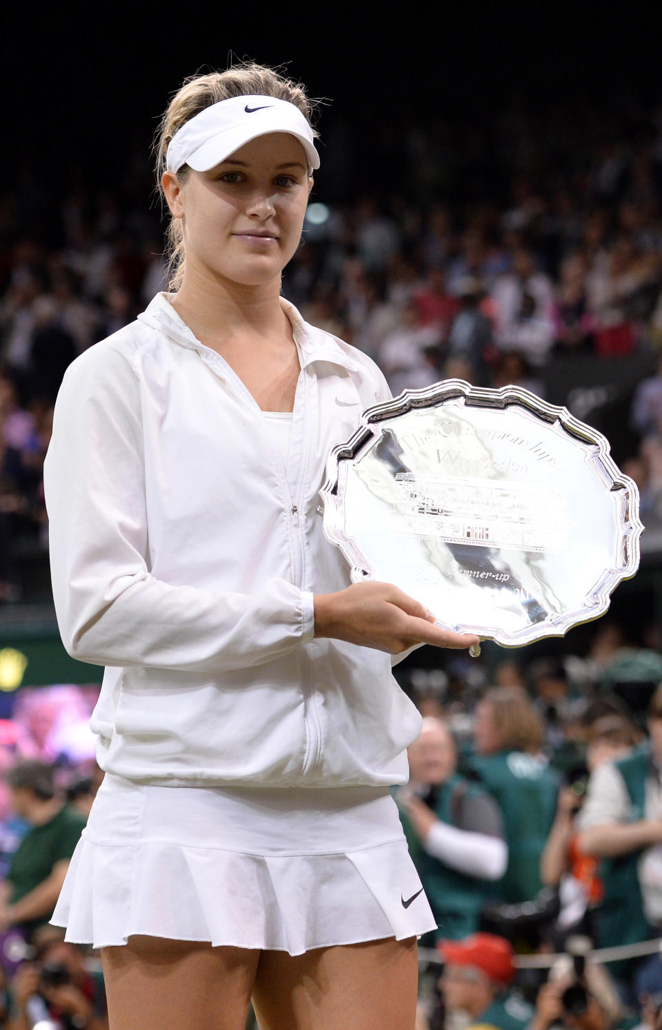 Eugenie Bouchard poses the runners-up trophy after losing to Petra Kvitova in the ladies singles final on centre court during day twelve of the Wimbledon Championships at Wimbledon on July 5, 2014 in London, England.  (Photo by Karwai Tang/WireImage)